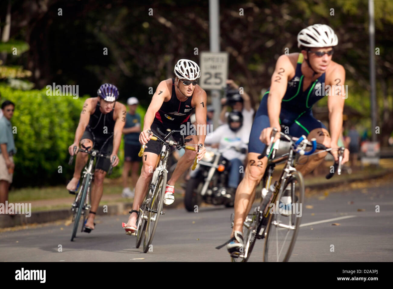 Honolulu, Hawaii Bicyclists Round A Corner During The Bike Leg Of The 2004 Usa Triathlon