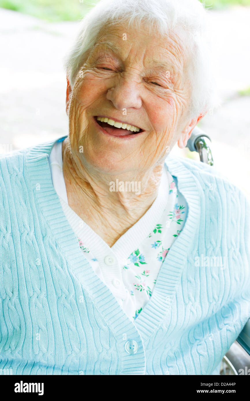 Senior woman in wheelchair with a huge smile Stock Photo - Alamy