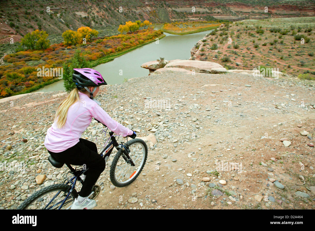 Young girl 10 mountain biking on rustler trail hires stock photography