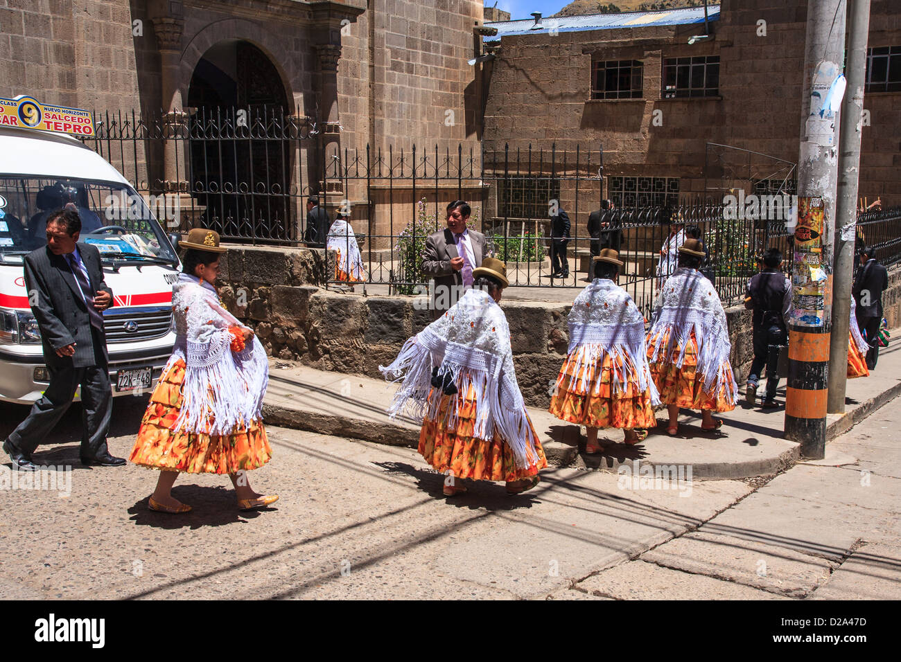 Peruvian women preparing ceremony in iglesia San Antonio (church) in puno Stock Photo