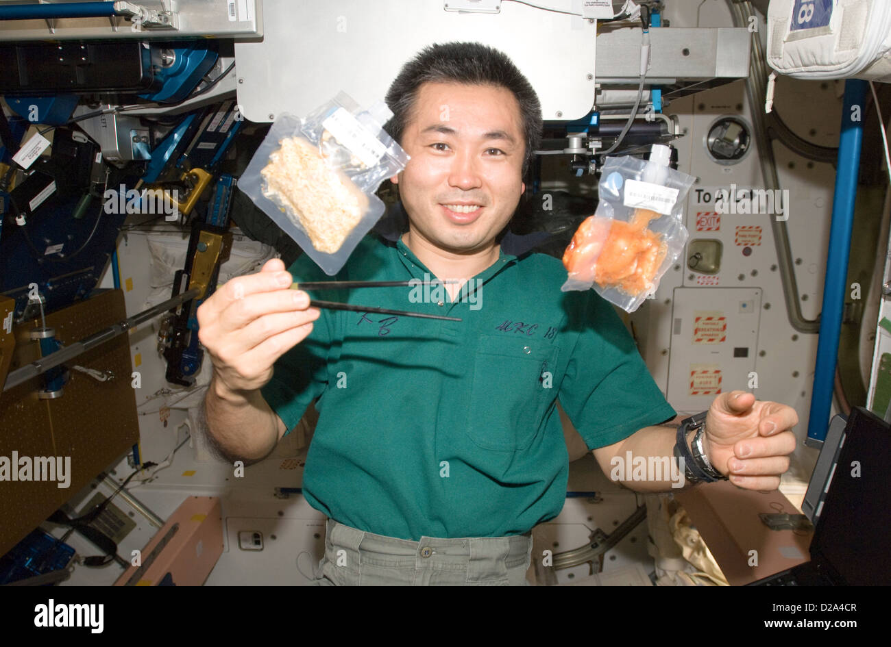 3 June 2009 Japan Aerospace Exploration Agency (Jaxa) Astronaut Koichi Wakata Expedition 20 Flight Engineer Holds Chopsticks Stock Photo