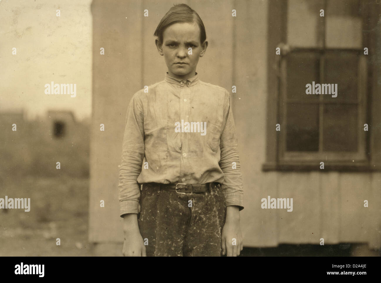 Charlie Lott Thirteen Year Old Doffer In Cotton Mill West His Family Record Says Born March 12 1900 Has Been Working For Year Stock Photo