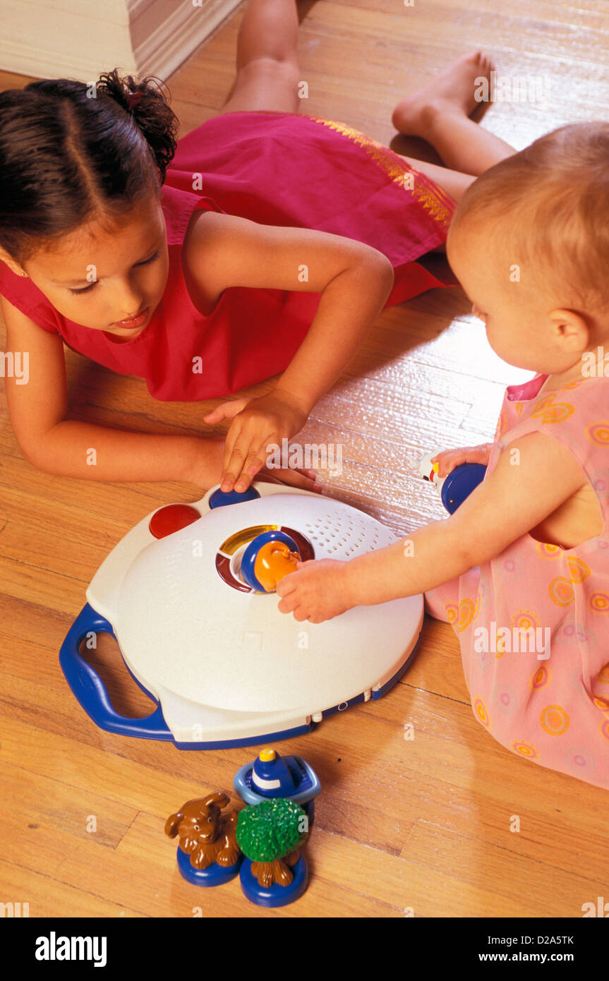 Children Playing With Language Translating Toy, Little Linguist Stock Photo
