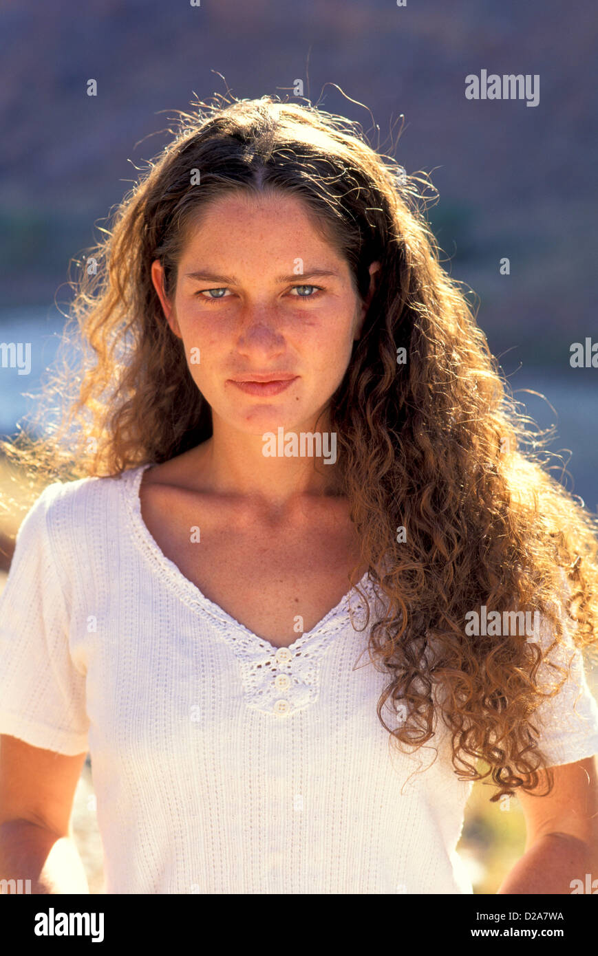 Portrait Of Woman With Long Brown Hair Stock Photo
