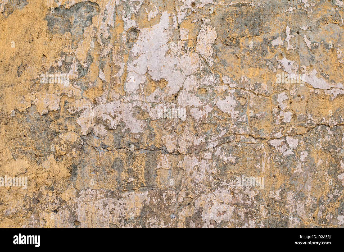 Old yellow grunge painted wall with brown spots Stock Photo Alamy