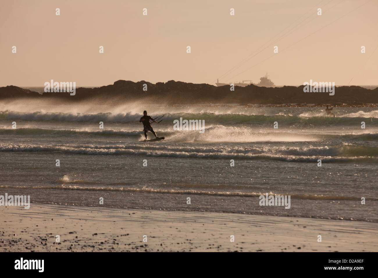 Man windsurfing in waves Stock Photo