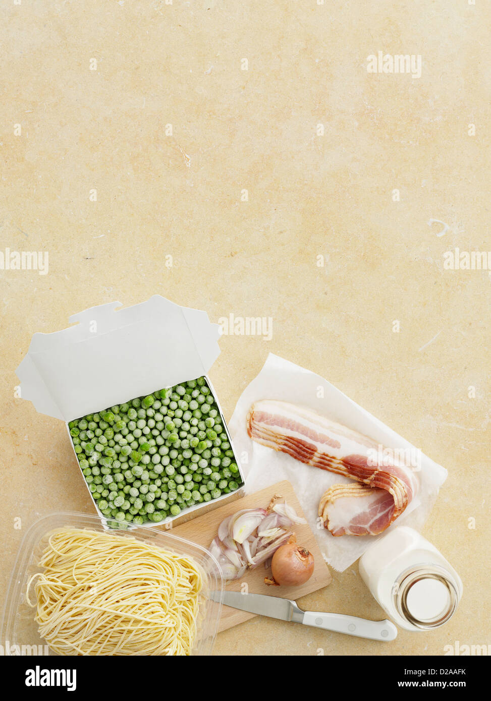 Fresh pasta, peas, bacon and onion Stock Photo