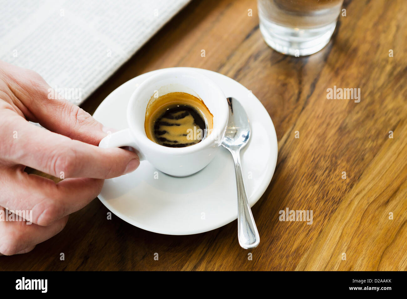 Close up of hands holding cappuccino Stock Photo