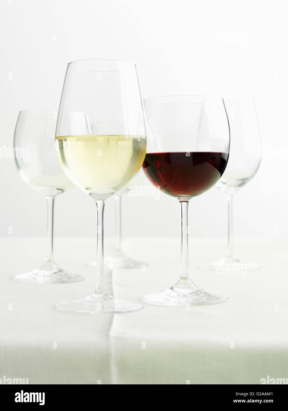 Glasses of red and white wines Stock Photo
