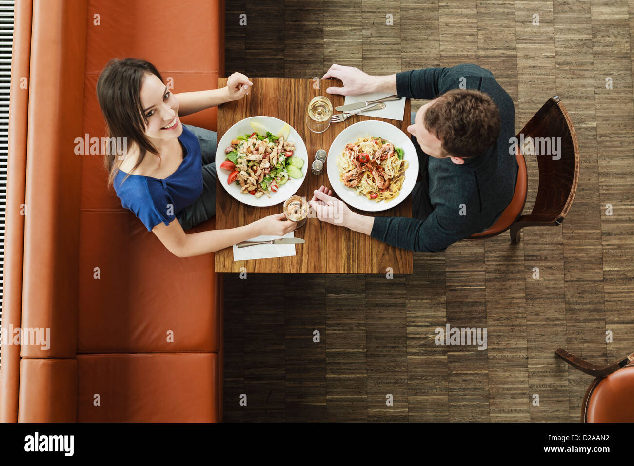 Couple having lunch at cafe Stock Photo
