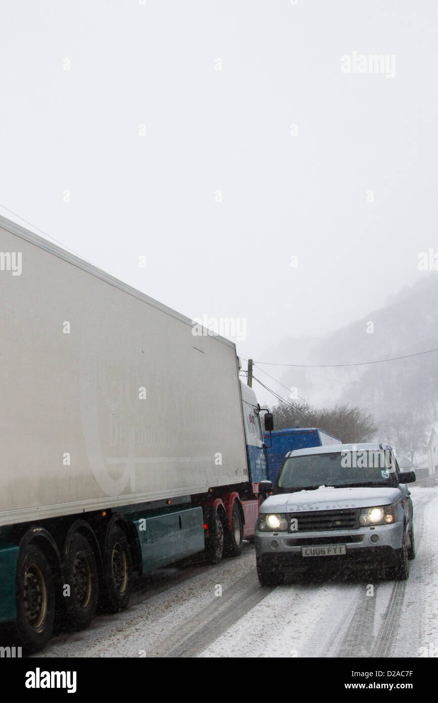 Wales, UK, 18 January 2013. A Halfords lorry gets stuck in snow and blocks the A44 trunk road near Ponterwyd in mid Wales. Heavy snow and high winds cause dangerous driving conditions on Welsh roads. Stock Photo