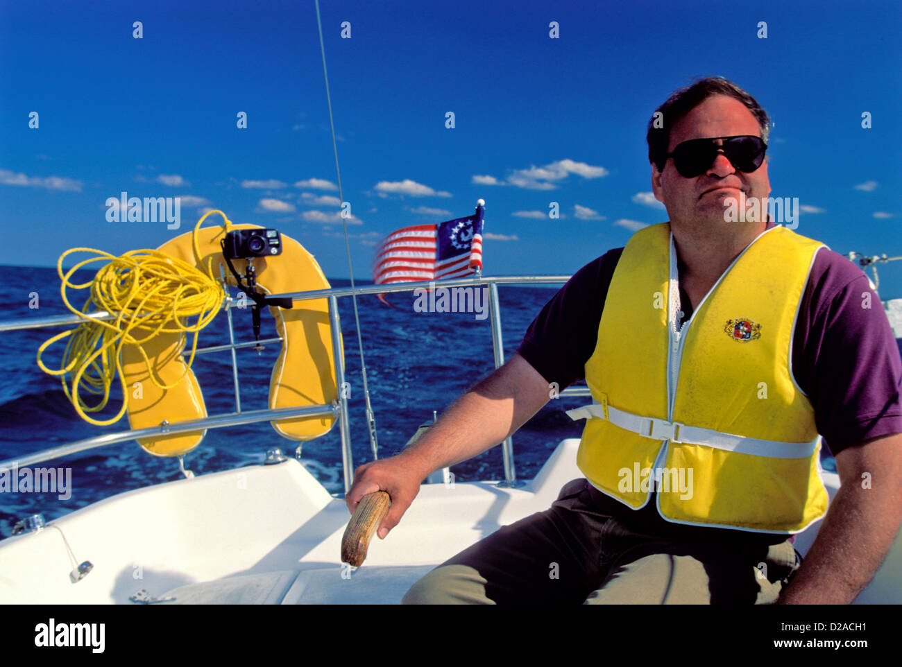 Man At Rudder, Sailing On Chesapeake Bay, Virginia Stock Photo