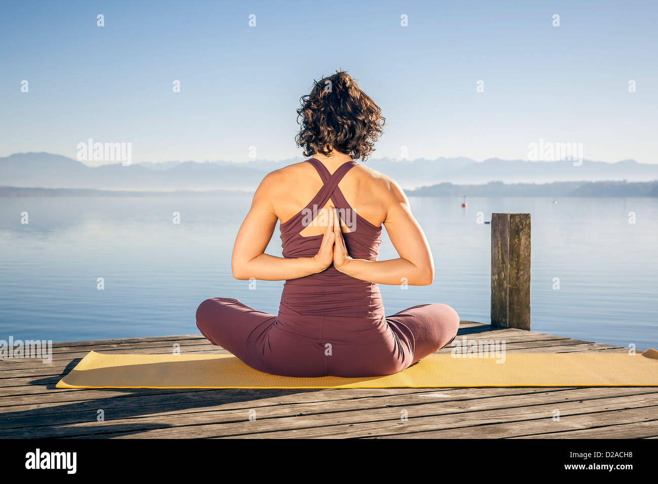 An image of a pretty woman doing yoga at the lake Stock Photo Alamy
