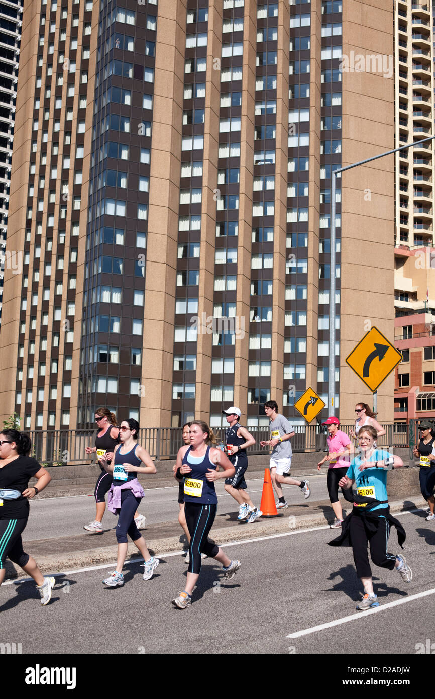 Crowds of fitness enthusiasts on a charity fun run through Sydney's CBD running across the Cahill Expressway. Stock Photo