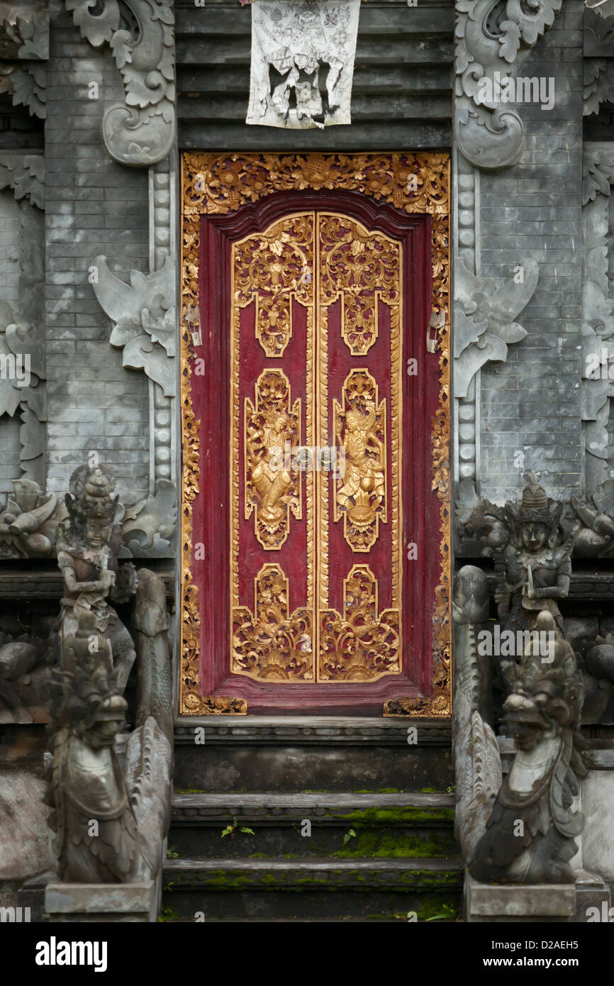 Entrance to indonesia hindu temple with carved wooden door. Stock Photo