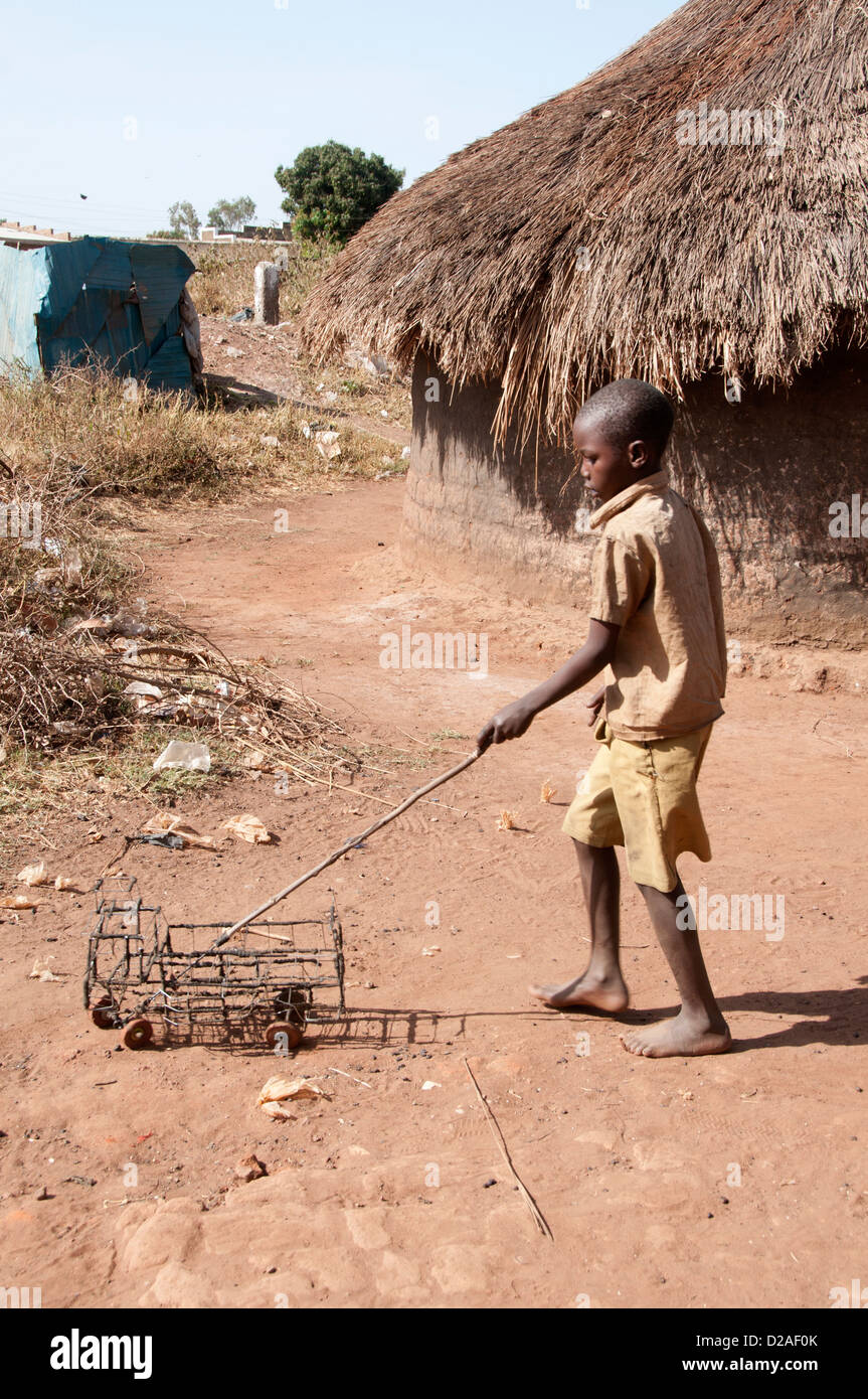 Uganda. Lira - boy playing with truck made out of wire Stock Photo