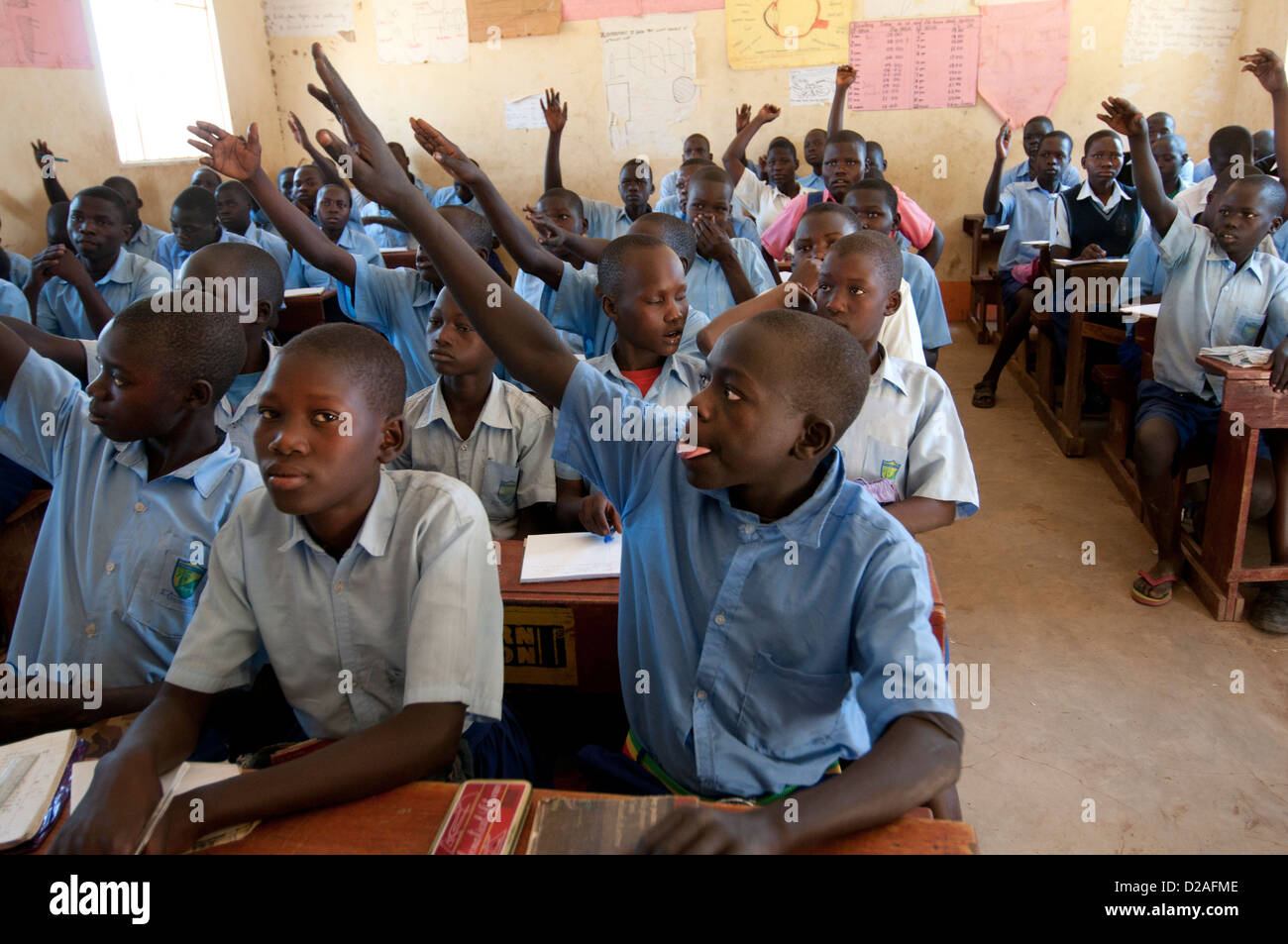 Uganda.Palenga primary school, near Gulu. Classroom of mostly boys with their hands up Stock Photo
