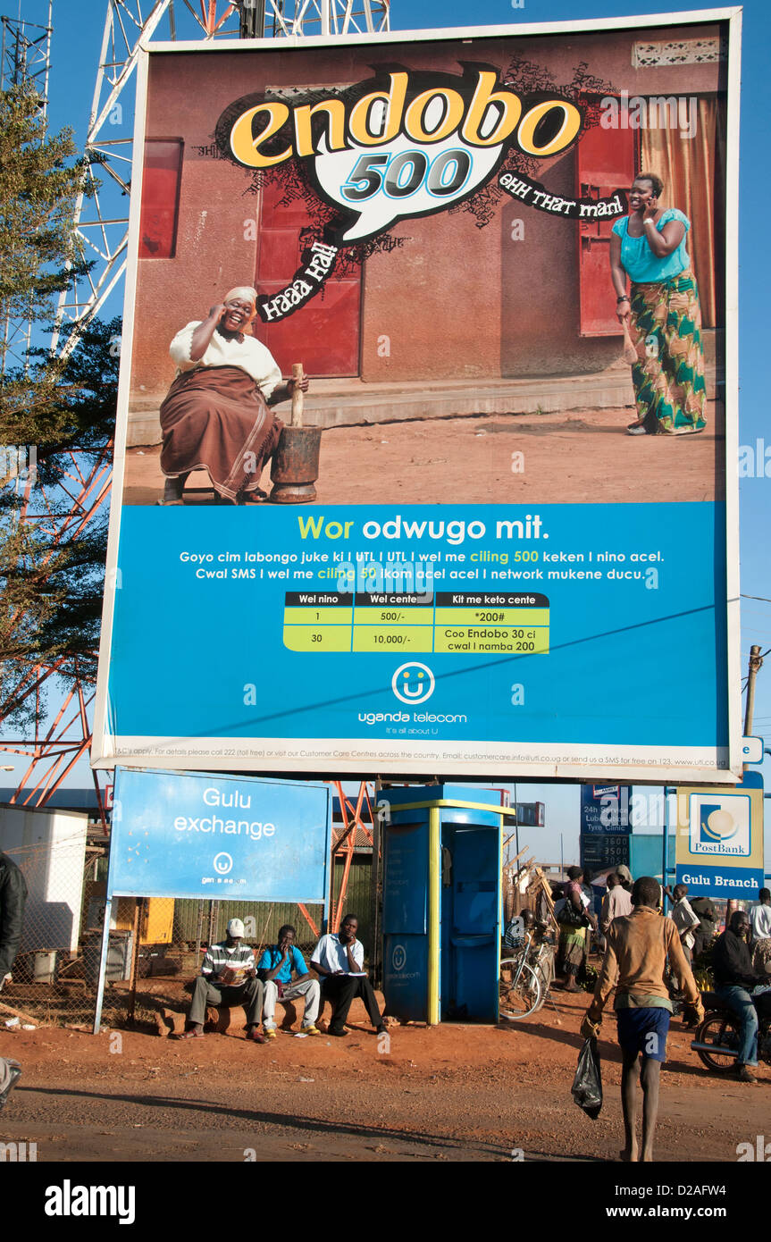 Gulu, Uganda. A giant billboard adverting cellphones shows two African