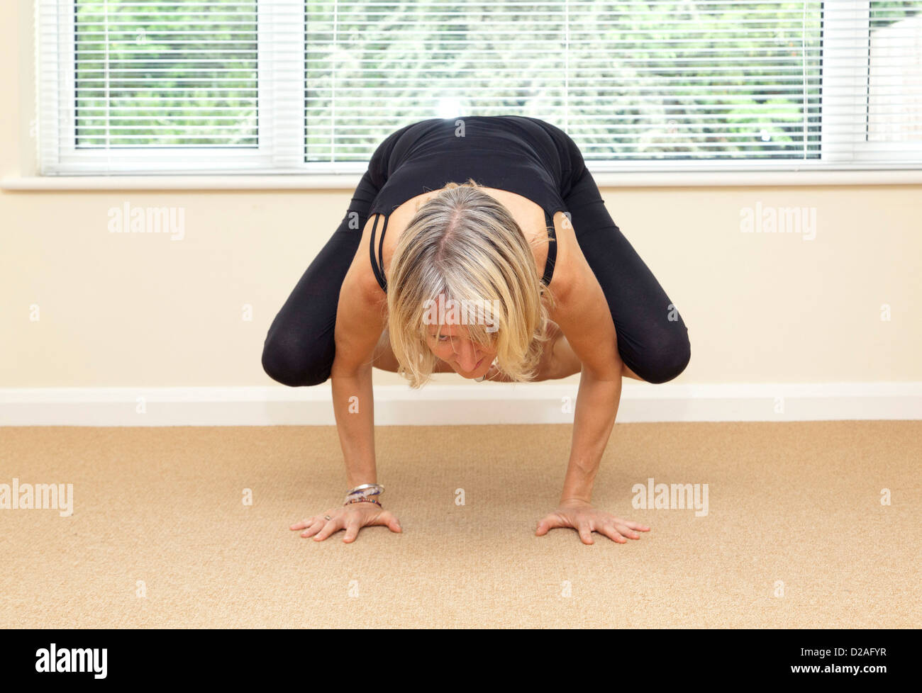crow yoga pose Stock Photo