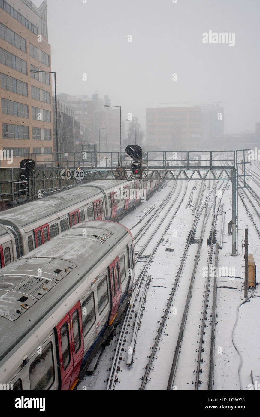 Harrow, London UK. 18th January 2013. Two Trains on the train tracks in the snow in the London borough of Harrow as heavy snow falls across the UK. Photo credit: Credit:  Peter Barbe / Alamy Live News Stock Photo