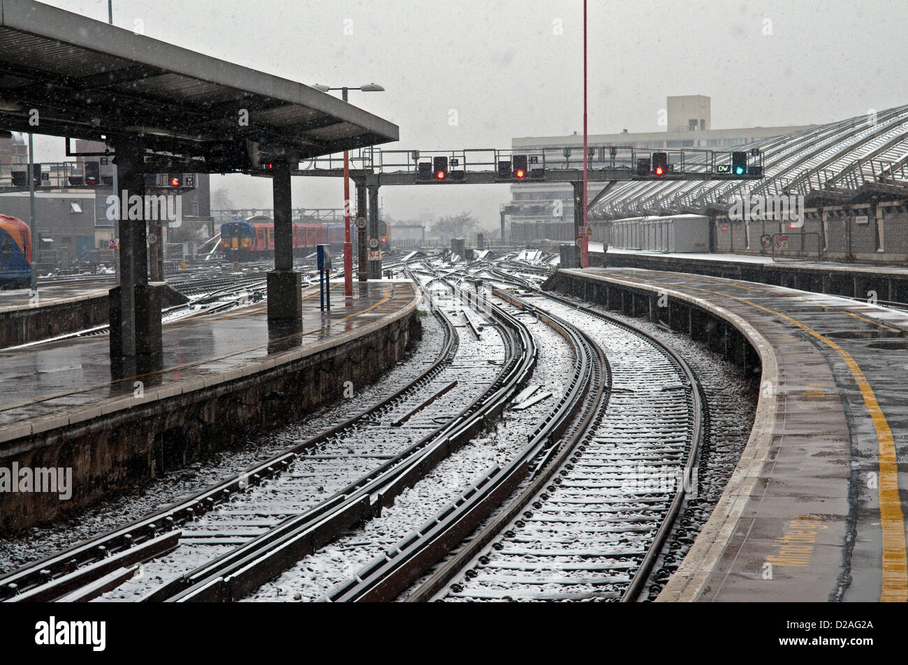 London, UK. 18th Jan, 2013. Snow settling on railway lines at Waterloo Station in central London as a band of snow sweeps across the country. Stock Photo