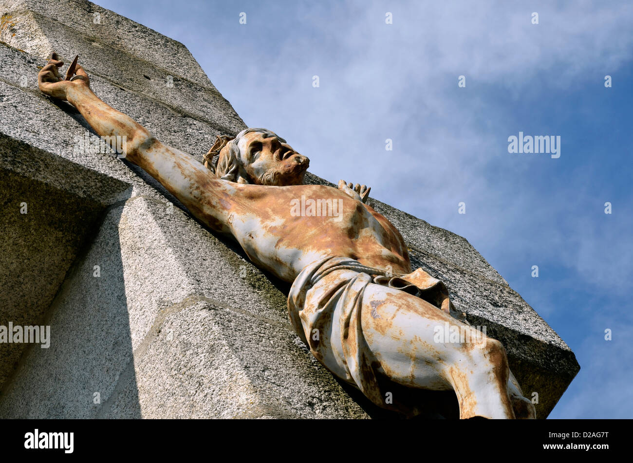 Closeup of Jesus on the stone cross of Salette calvary at Lautrec in southern France. Midi-Pyrénées region, Tarn department Stock Photo
