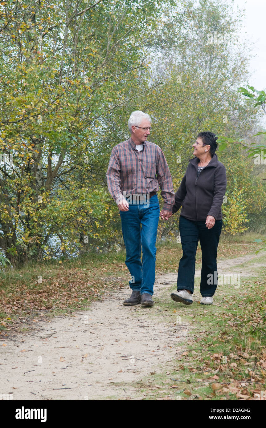 Attractive couple walking woods hi-res stock photography and images - Alamy