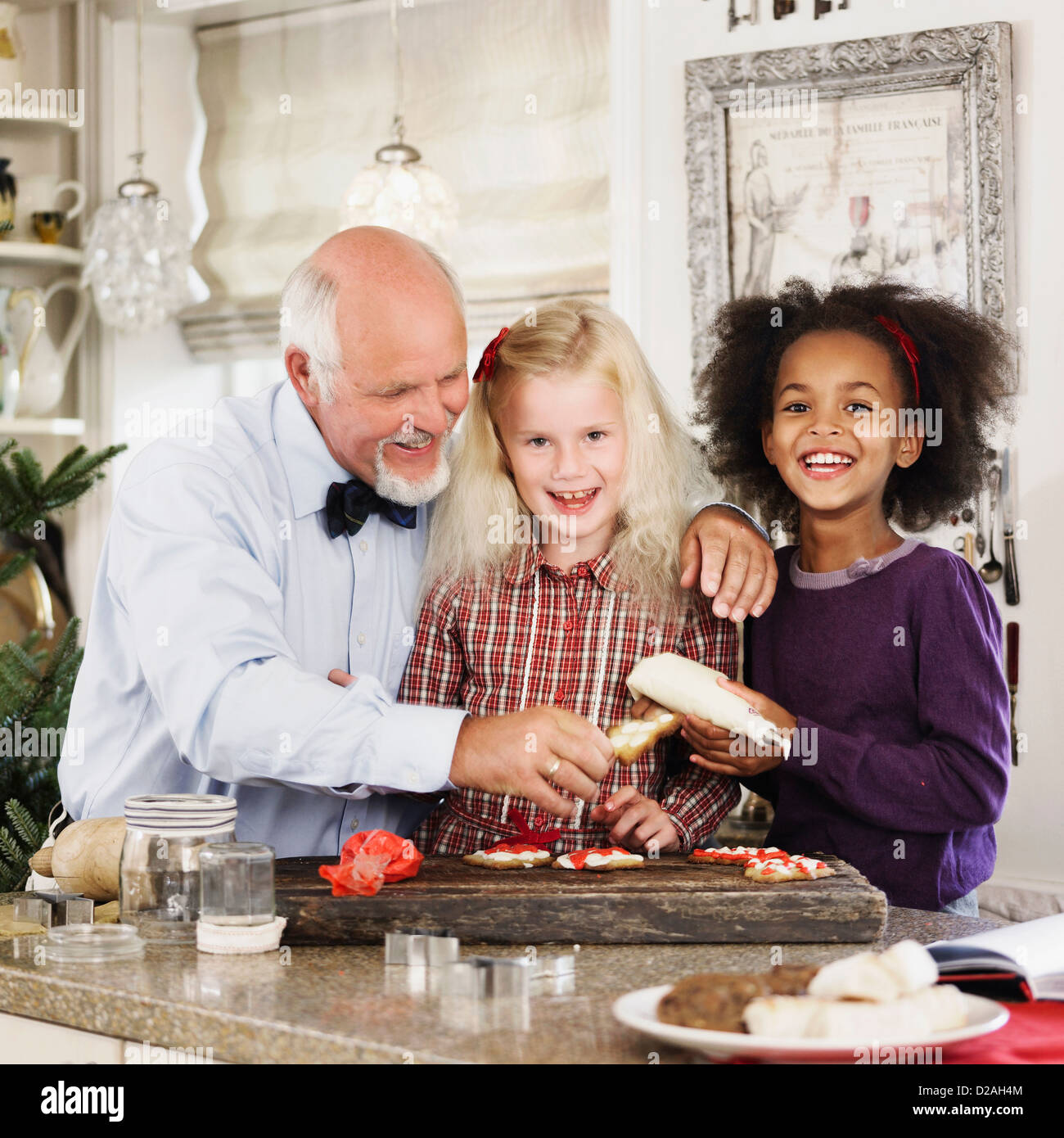 Family baking Christmas cookies together Stock Photo Alamy