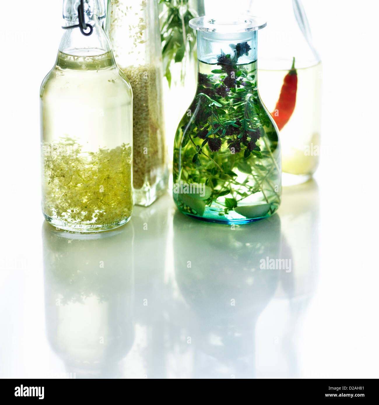 Bottles of herbed olive oil Stock Photo - Alamy