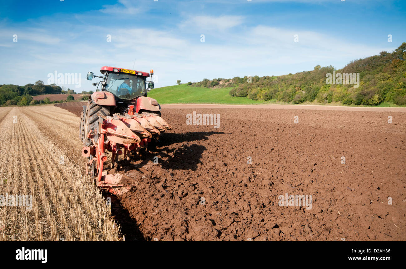 Tractor ploughing a field in southern Scotland Stock Photo Alamy