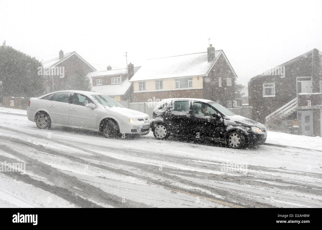 Brighton Sussex UK. 18 January 2013 - Two cars slide into each other as there was gridlock on the roads at Woodingdean near Brighton this morning as blizzard conditions made it almost impossible to get through Stock Photo