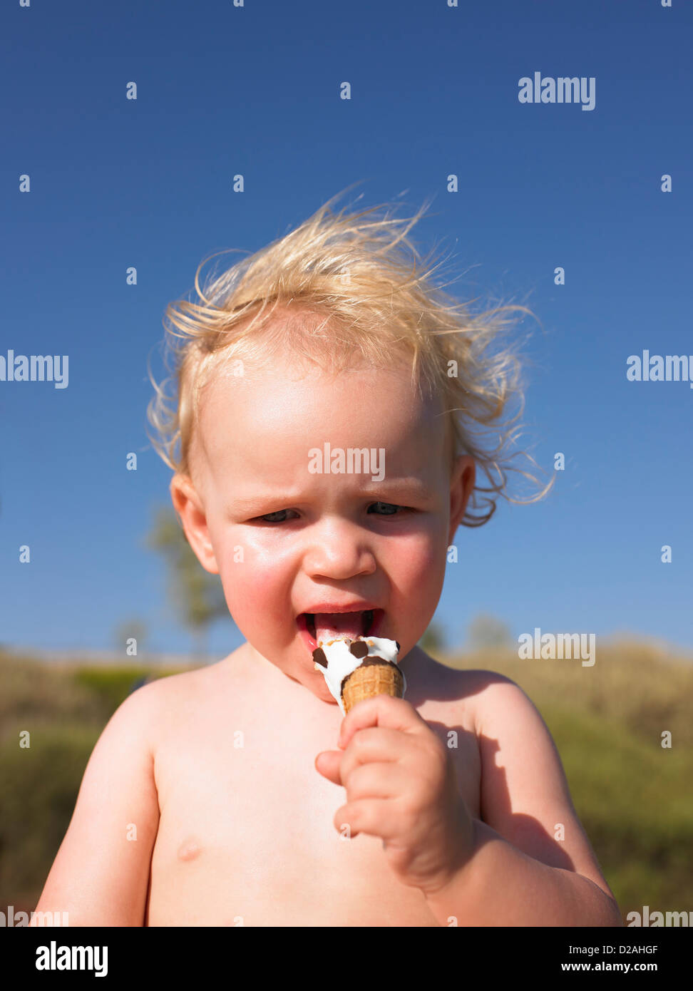 Toddler girl eating ice cream cone Stock Photo Alamy