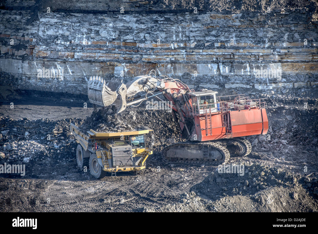 Trucks and digger at surface coal mine Stock Photo