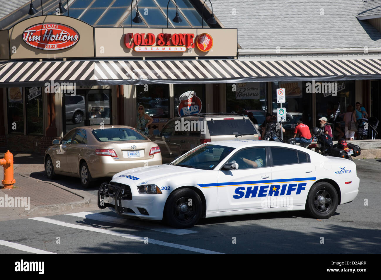 The sheriff's police car parked outside the Cold Stone Creamery and Tim Hortons in Halifax Stock Photo