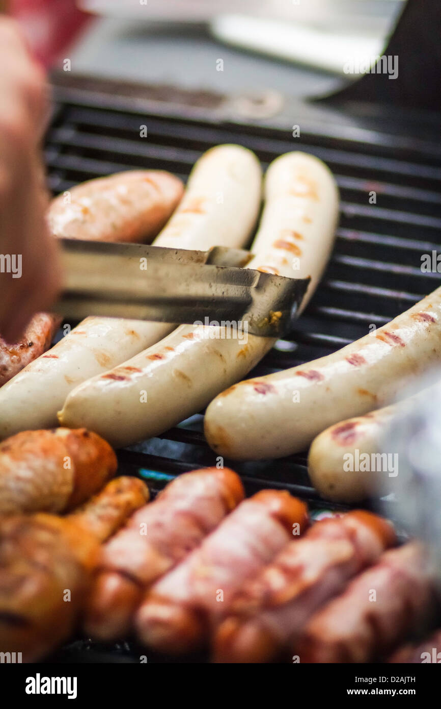 Close up of sausages cooking on grill Stock Photo Alamy