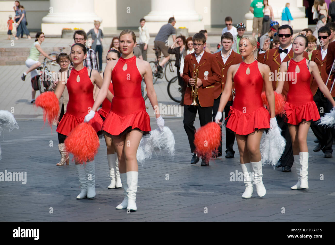 Cheer leaders supported by a marching band, led a protest march of the