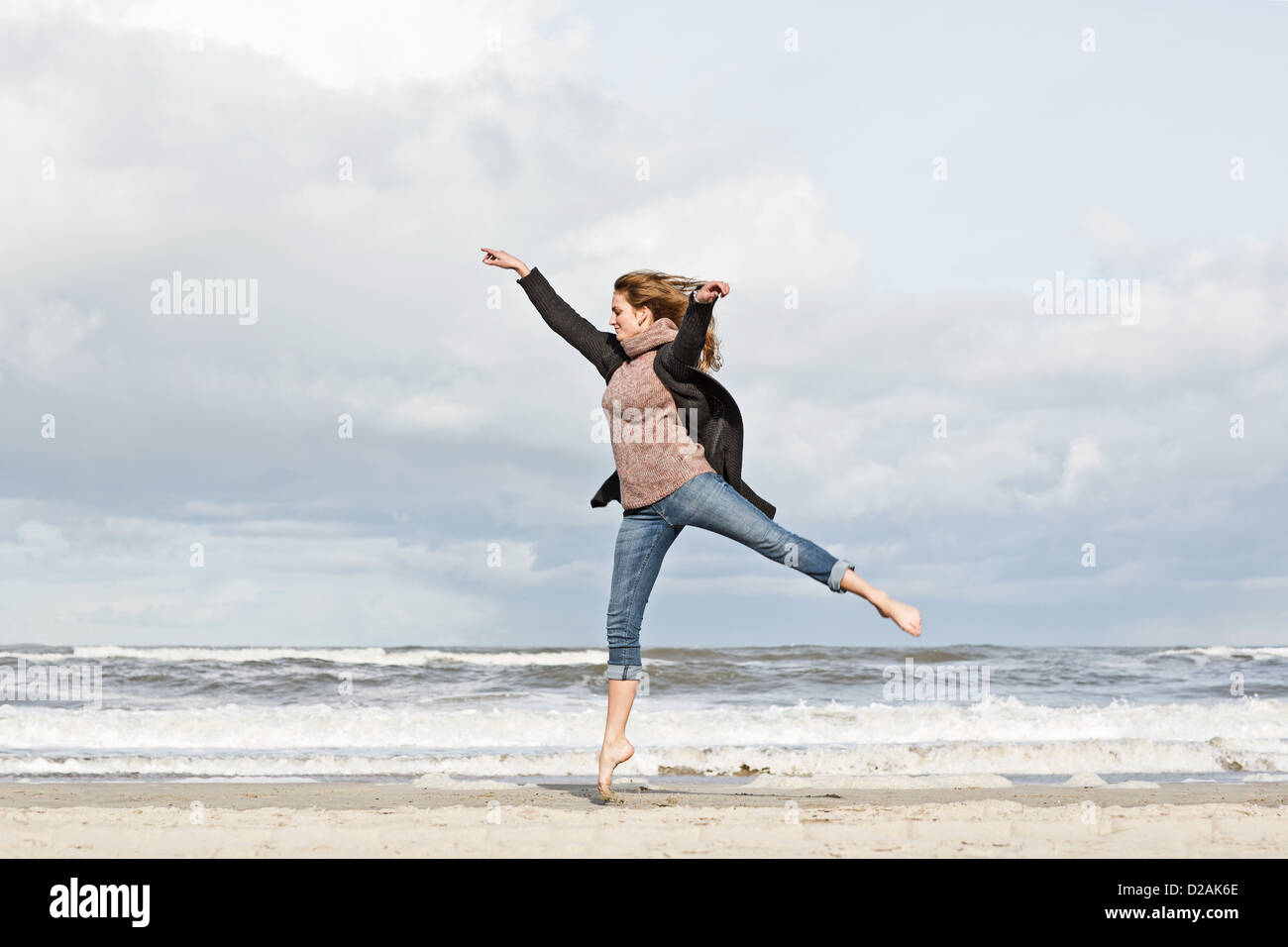 Woman dancing barefoot on sand hi-res stock photography and images - Alamy