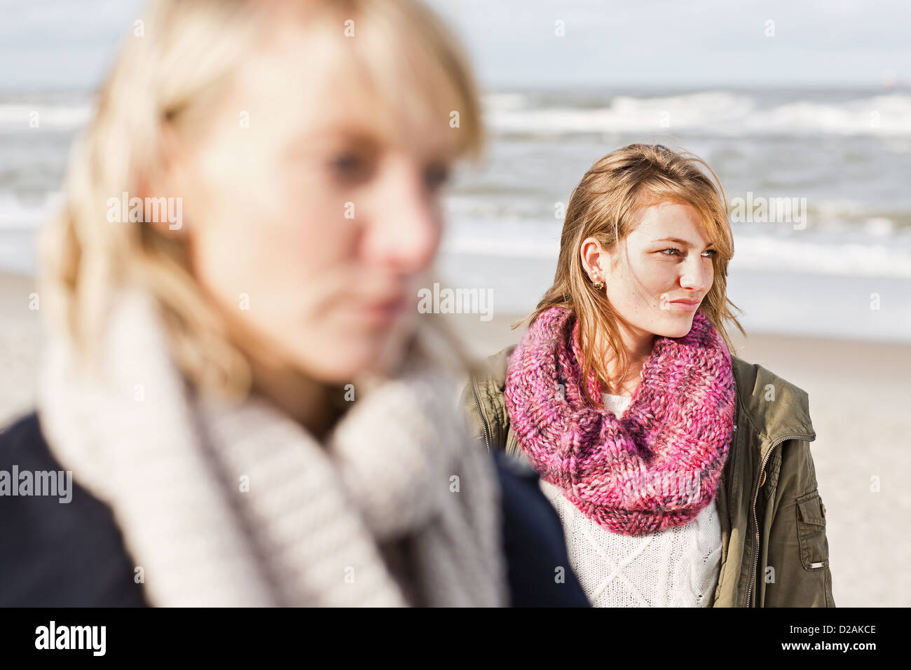 Women standing on beach Stock Photo