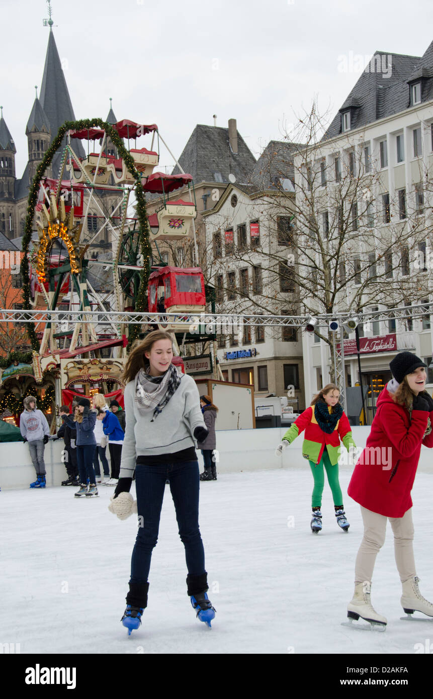 Germany, Cologne. Annual Christmas Market, children and teens skating on