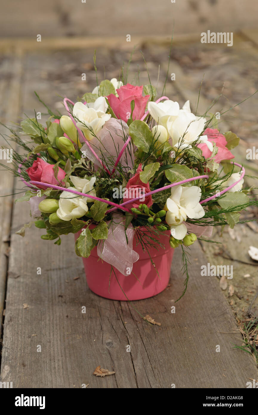 Pink bucket of flowers Stock Photo