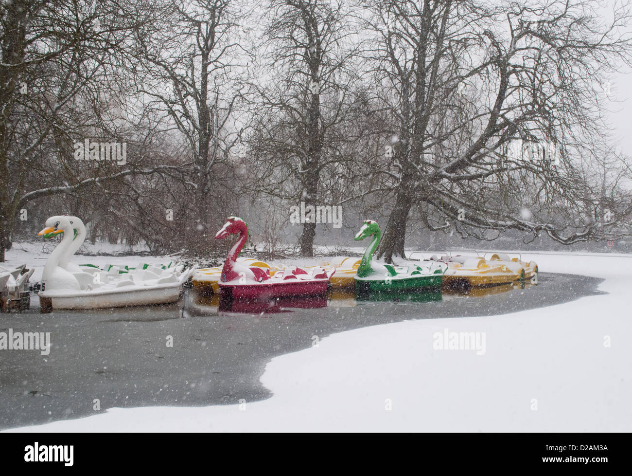 18/01/2013, Alexandra Palace, London UK. Pleasure boats look surreal as heavy snow falls on the frozen boating lake in the grounds of Alexandra Palace, north London. Stock Photo