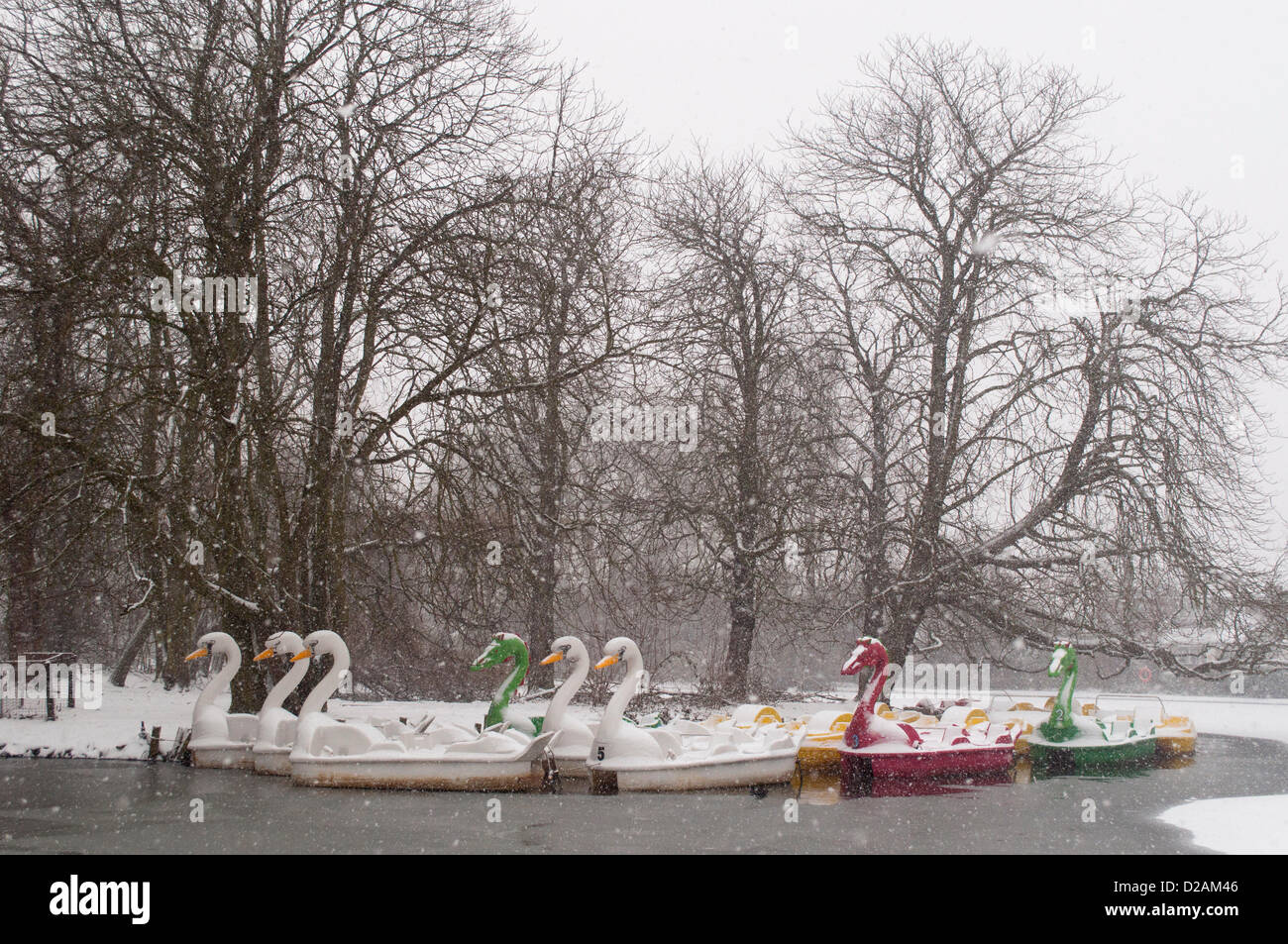 18/01/2013, Alexandra Palace, London UK. Pleasure boats look surreal as heavy snow falls on the frozen boating lake in the grounds of Alexandra Palace, north London. Stock Photo