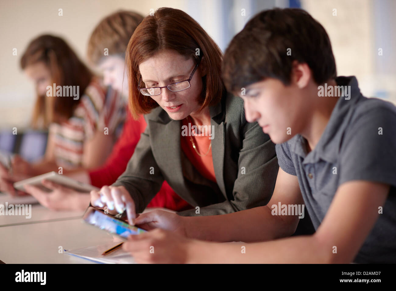 Student and teacher with tablet computer Stock Photo