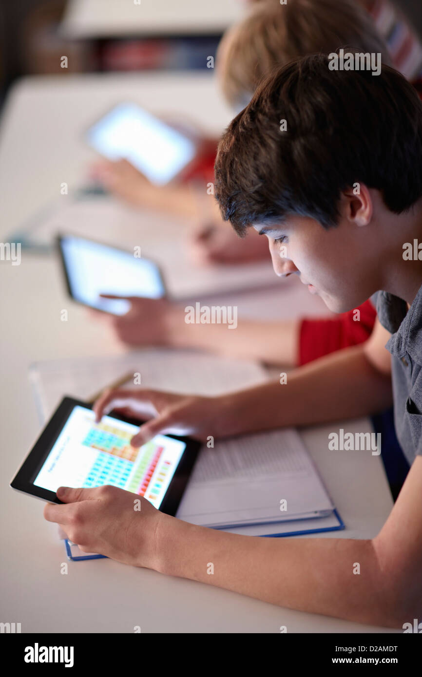 Students using tablet computers in class Stock Photo