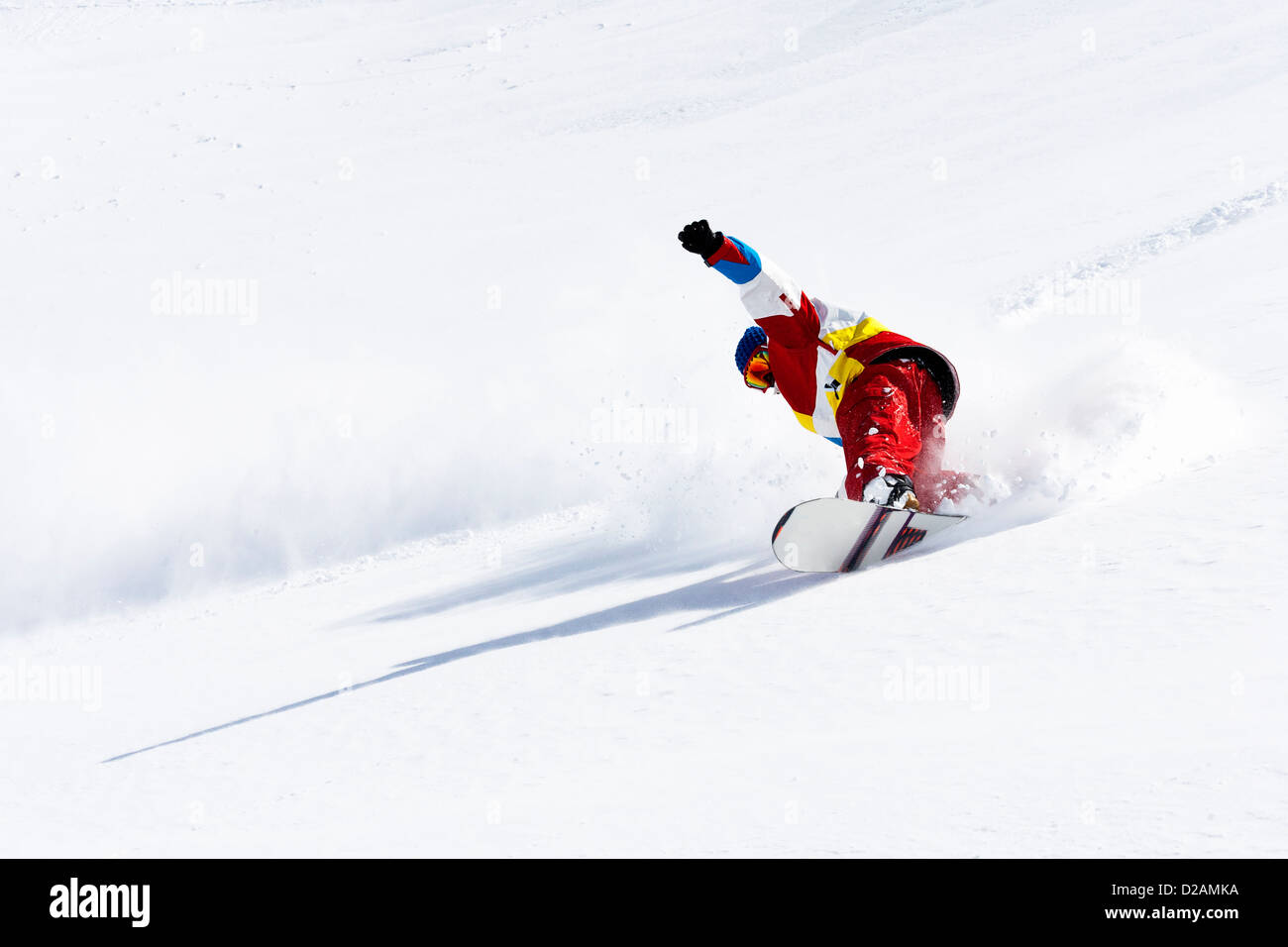Snowboarder on snowy slope Stock Photo