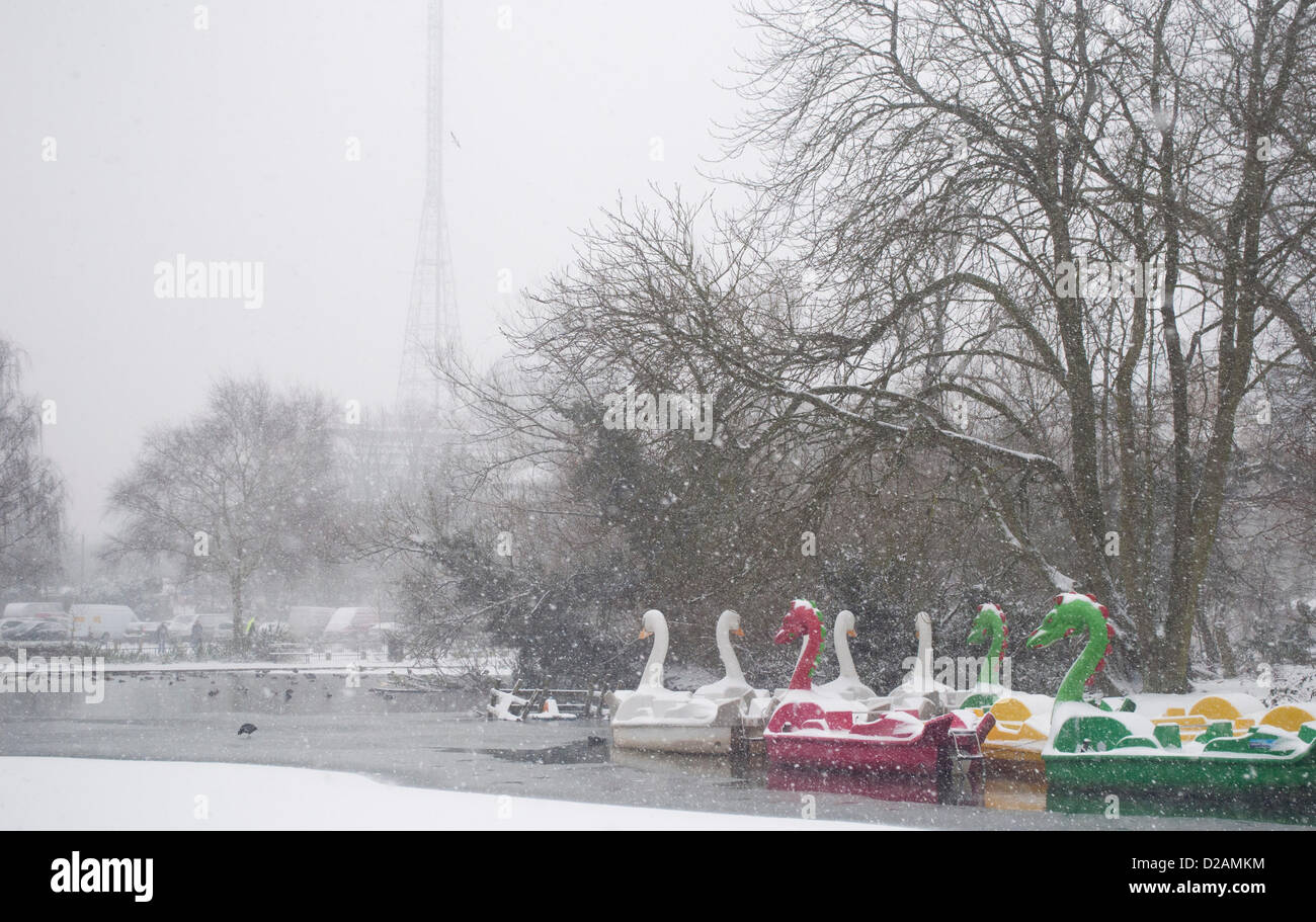 18/01/2013, Alexandra Palace, London UK. Pleasure boats look surreal as heavy snow falls on the frozen boating lake in the grounds of Alexandra Palace, north London. Stock Photo