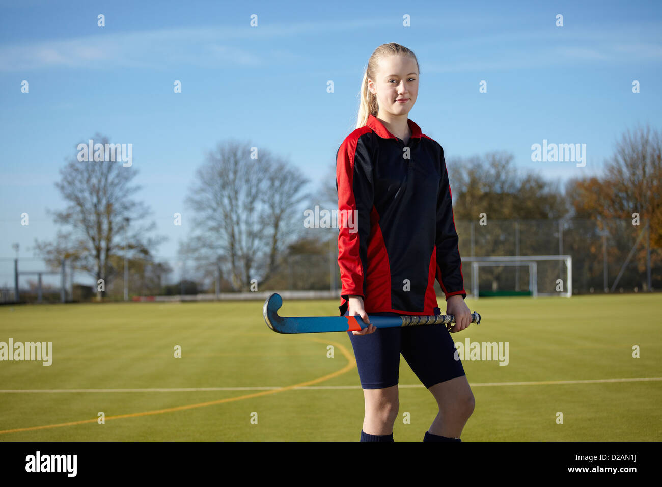 Lacrosse player standing on field Stock Photo Alamy