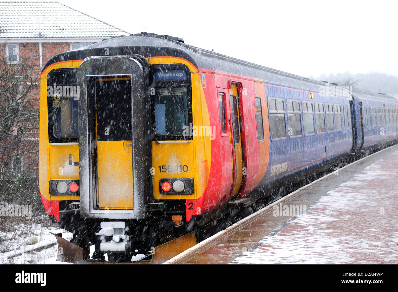 Hucknall,Notts.UK.18th January.2013.Trains,Trams and Buses continue to operate during Blizzard.Robin Hood line station for Trams and Trains. Stock Photo