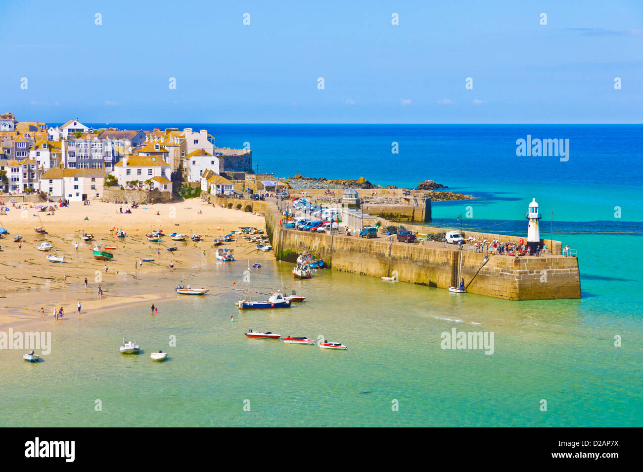 St Ives Cornwall Holidaymakers on the beach at The Island or St Ives Head St Ives Cornwall England GB UK Europe Stock Photo