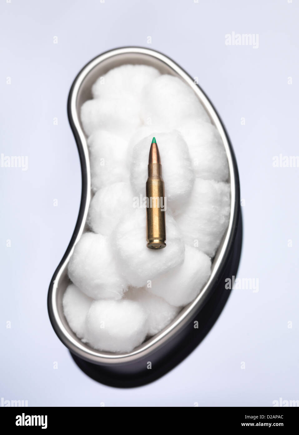 Bullet in tray of cotton balls in lab Stock Photo